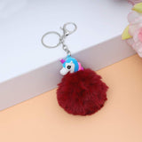 Sea Horse Character Fluffy Ball hanging Keychain (Any Random Color)